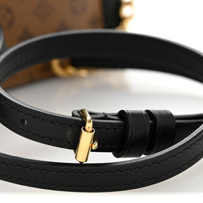 Reverse Monogram Trunk Clutch