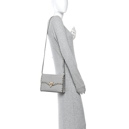 Pebbled Calfskin Medium Rockstud Flip Lock Crossbody Bag Pastel Grey