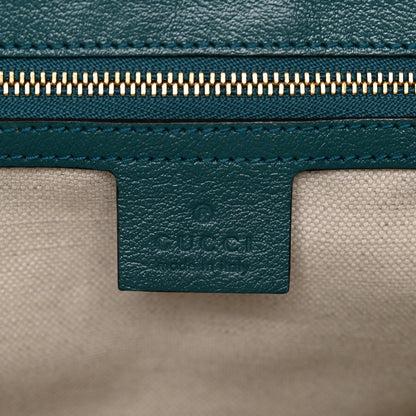 Azalea Calfskin Enamel Matelasse Diagonal Small Torchon GG Marmont Shoulder Bag Imperial Blue Pavone
