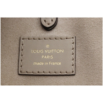 LOUIS VUITTON Onthego MM Giant Monogram Empreinte Shoulder Bag Tourterelle