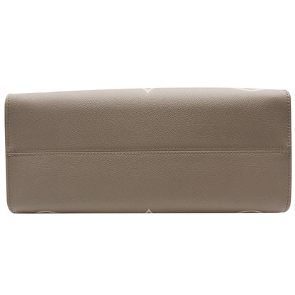 LOUIS VUITTON Onthego MM Giant Monogram Empreinte Shoulder Bag Tourterelle