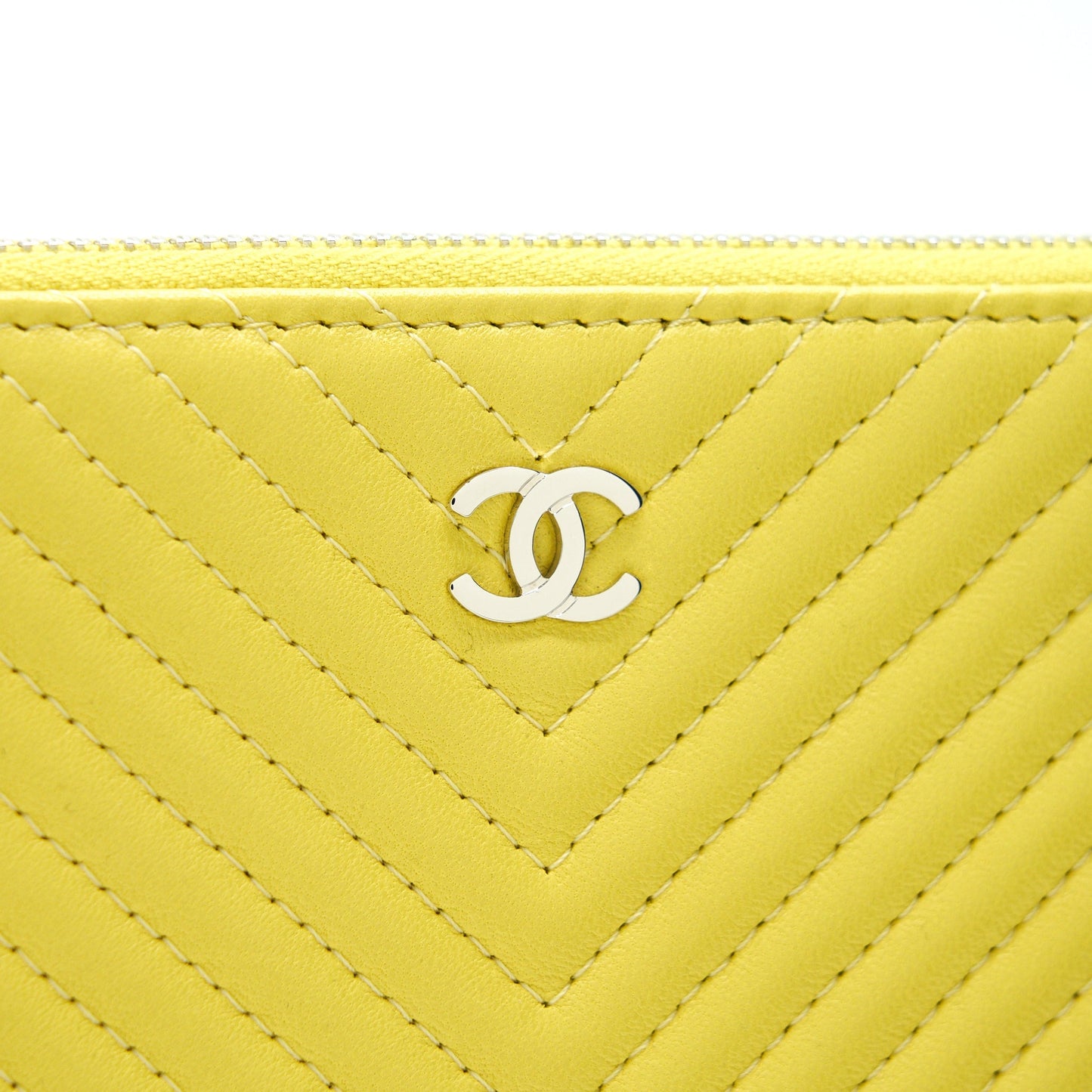 CHANEL CHEVRON CLUTCH BAG IN YELLOW