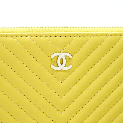 CHANEL CHEVRON CLUTCH BAG IN YELLOW