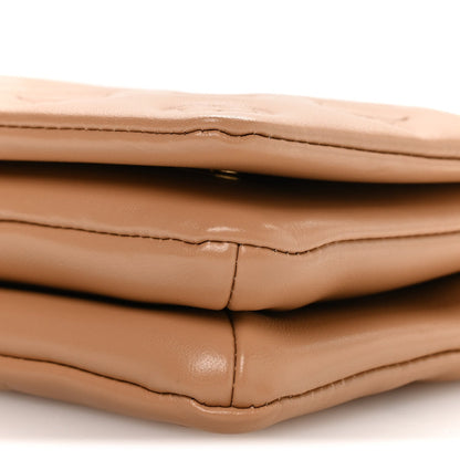 Lambskin Embossed Monogram Pochette Coussin Camel