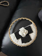 Chanel 23  White Quilted Leather Mini Round Camellia Clutch